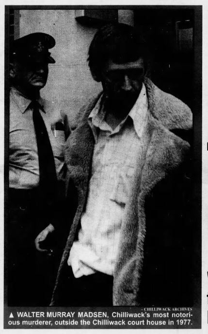 A photo of Walter Murray Madsen outside the Chilliwack court house in 1977. The image is dark, giving Madsen a creepy look that blocks out many of his facial features.